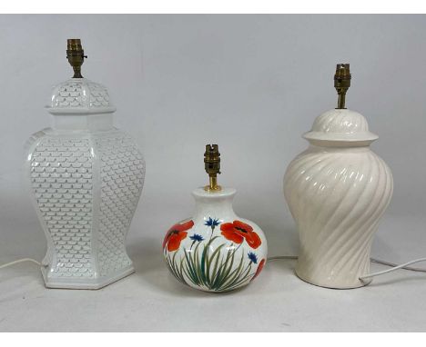 Three decorative ceramic lamp bases, one decorated with poppies, largest height 40cm (3).