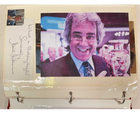 A red ring binder containing one hundred plus pages of single and multiple colour and black and white photo images signed by 