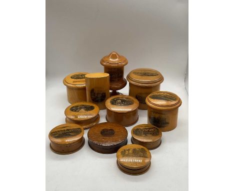MAUCHLINE WARE; eleven trinket boxes including large cylindrical example, 'Barnstaple, North Devon, Brixham Harbour &amp; Pet