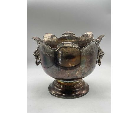 ELKINGTON & CO; a George V hallmarked silver Monteith, with shaped rim and twin lion mask ring drop handles on spreading circ