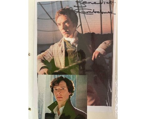 A black ring binder album containing colour and black and white signed photo images and promotional cards and separate papers