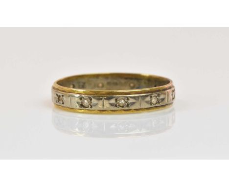An 18ct yellow and white gold full eternity ring, size Q, approx 2.6g.