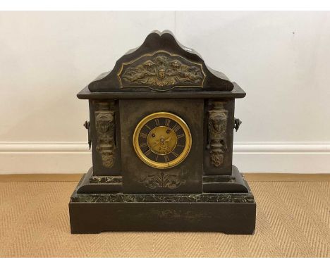 A large late 19th century French black slate mantel clock with green marble detail, width 50cm.