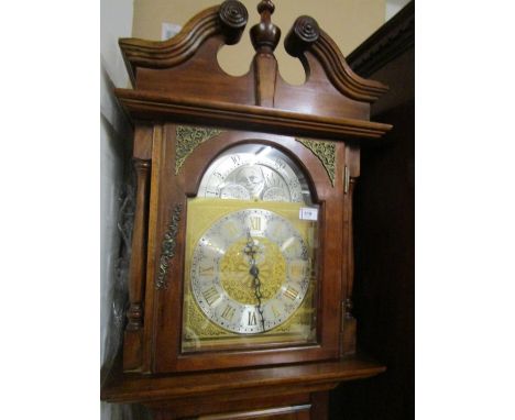 A reproduction Emperor Clock Co long case clock with swan neck pediment, arched moon phase, three sleeved weights and a box b