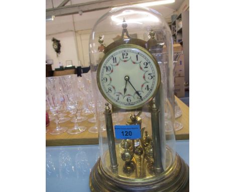 A mid 20th century anniversary clock under a glass dome 
