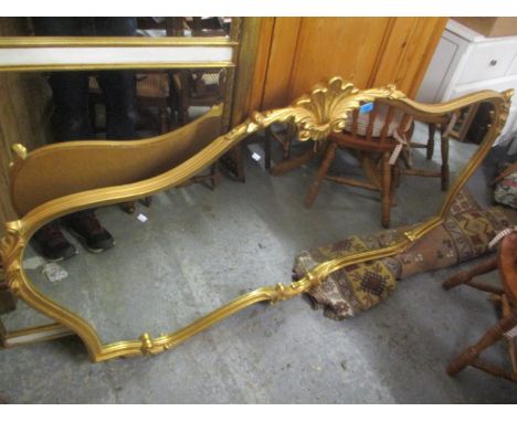 A modern rococo style gilt framed wall mirror having shell and scroll decoration, 36" h x 66"w 