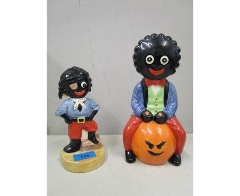 Two Carlton ware golly figurines, one golly on a space hopper, a limited edition No 76/100, the other a flatback pirate golly