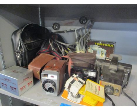 A selection of vintage cameras and photographic accessories to include a Pentax and a Land camera 