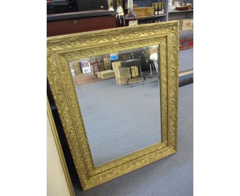 An ornate gilt wall mirror, 36" x 28" 