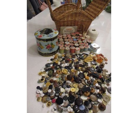 A sewing basket and contents to include wooden cotton reels such as Silko and Barbours, together with a vintage tin containin