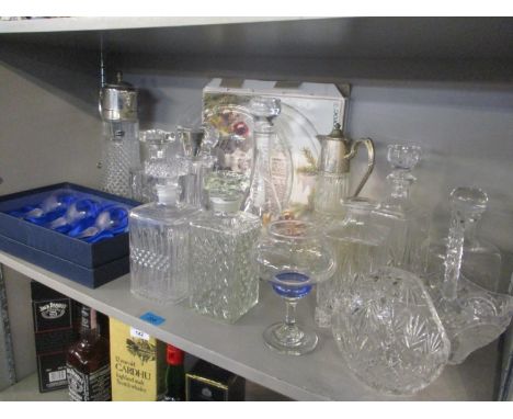 Glassware to include nine decanters and two silver plated claret jug along with other items 