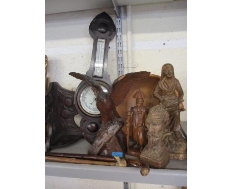 A carved treen model of a bird of prey A/F (damage to the beak and wings), a carved treen figure of an old lady collecting fi