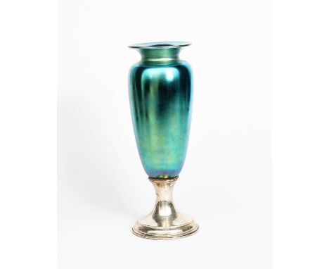 A tall Tiffany &amp; Co green lustre glass vase with silver foot, slender shouldered glass body with flaring top rim, covered