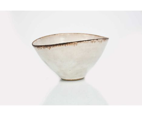 Φ Dame Lucie Rie DBE (1902-1995)a stoneware bowl, flaring elliptical form, covered to the foot with a silver-grey glaze, the 