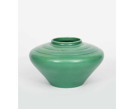 A Wedgwood Pottery vase designed by Keith Murray, shape no.3820, compressed shouldered form, covered in a matt green glaze, i