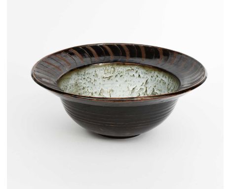 Φ David Leach OBE (1911-2005)a large Lowerdown Pottery bowl, the flaring rim with carved radiating comb design, glazed tenmok