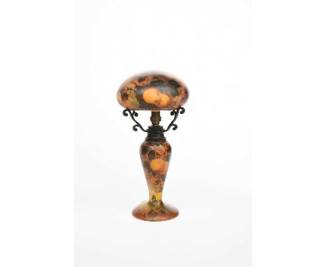 A French Art Nouveau glass table lamp and shade by Jean-Simon Peynaud, the base and mushroom shade painted with fruiting oran