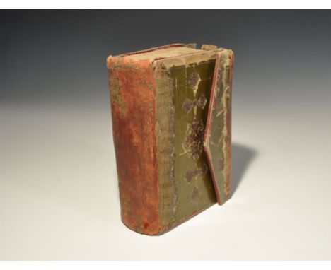 19th century AD. A leather-bound Q'ran manuscript with folding flap to the outer edge; black ink text with red diacritics and