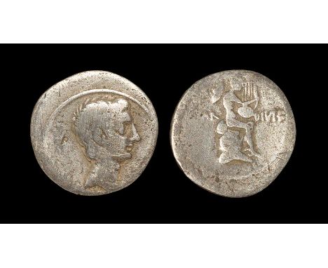 32-31 BC. Rome mint. Obv: bare head right. Rev: CAESAR DIVI F legend divided by Mercury seated on rock right, playing lyre. R