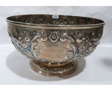 Paul Storr. 1770-1844. A George III silver table bowl with repousse chased decoration of scrolling foliage, the cartouche eng