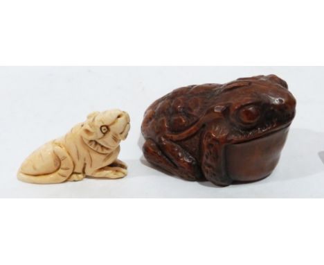 A Japanese carved boxwood toad netsuke and another carved as a rat in ivory