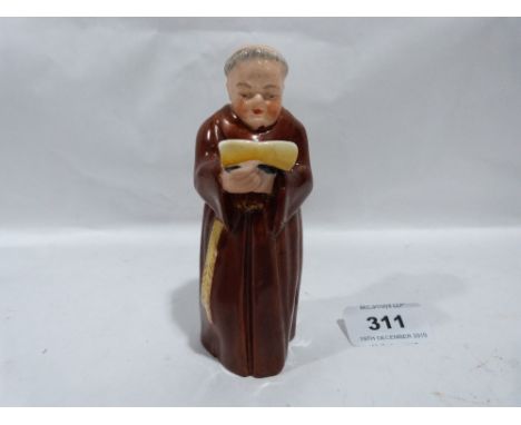 A Royal Worcester monk candle snuffer. 5' high
