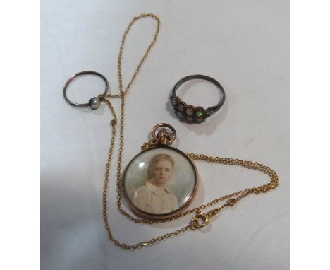 A pendant on necklet chain, painted to both sides with a portrait of a young boy, together with a gem set ring marked 625 and