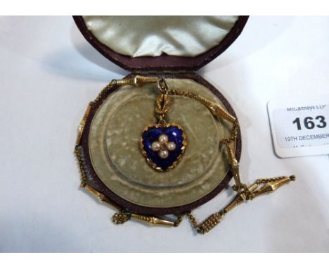 A Victorian gold and blue enamel heart pendant set with an old cut diamond and four split pearls, with reef knot suspension a