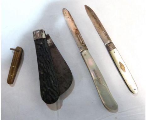 Two mother-of-pearl fruit knives with silver blades and two other knives 