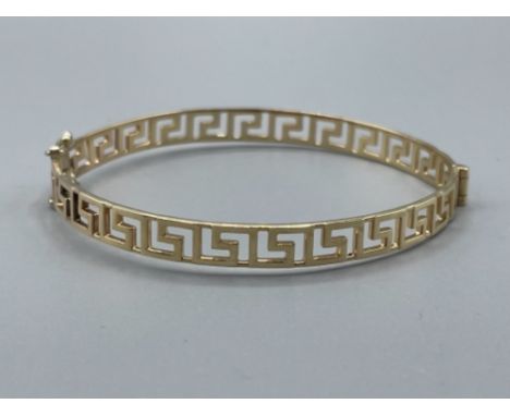 9ct gold fancy Greek key patterned Bangle. Very good condition 8.5G
