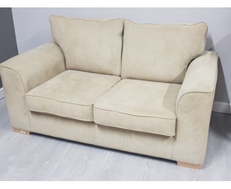 Modern upholstered 2 seater sofa, on beech effect foot supports in good clean condition