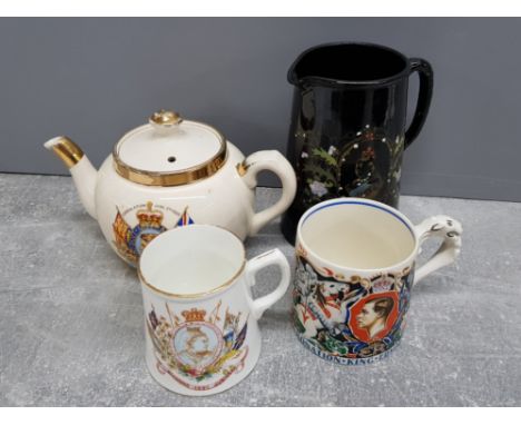 4 pieces of commemorative ware, includes teapot, 2 mugs one being designed by Laura Knight plus large black jug to commemorat