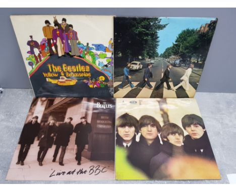 4 beatles LP records includes Yellow submarine nothing is real, beatles for sale, live at the bbc and Abbey road all with ori