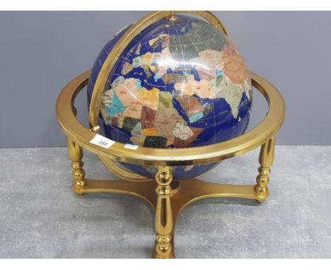 Large revolving Gemstone globe mounted in brass effect stand fitted with compass