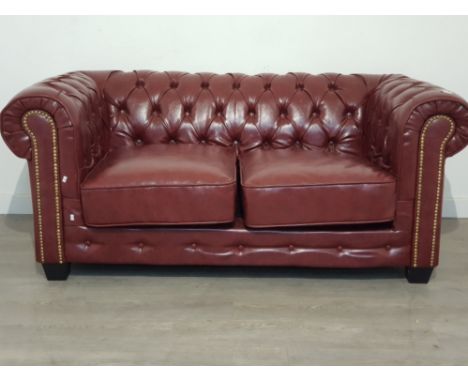 Two seater sofa great condition  .ox red made from leather.