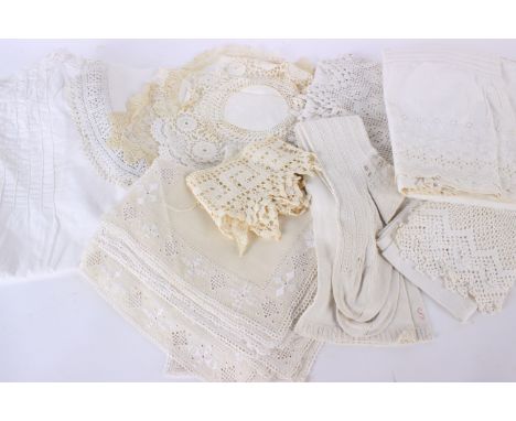 A collection of costume, including: a 19th century lace bonnet, a pair of lace cuffs, a late 19th century nightdress, a cream
