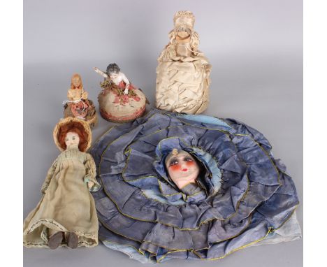 A 19th century silk pin cushion with ceramic doll body, a bisque pin cushion doll, a 1920s boudoir doll-head nightdress case,