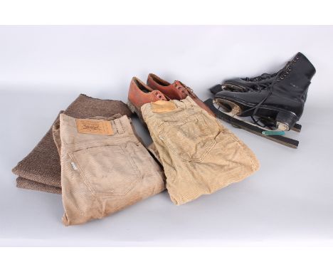 A mixed lot of costume and textiles, comprising: a 1970s red evening dress, bolts of wool suiting, Levi Strauss jeans, cordur