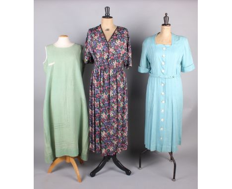 A 1940s floral print dress, a green cotton French workwear dress, a pale blue Moygashel 1940s dress, a black velvet bolero, a