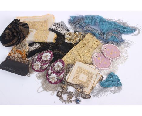 A collection of passementerie and trimmings, including: an early 20th century purse, woolwork and beaded watch pockets, 1920s