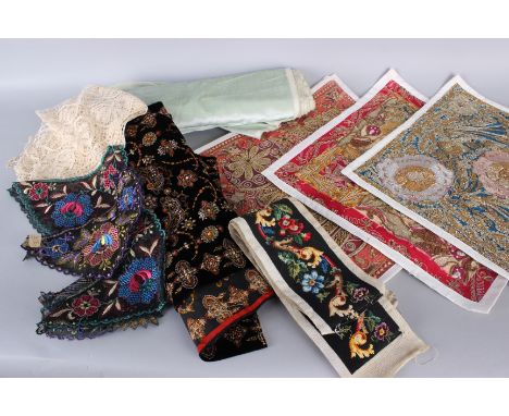 A collection of embroideries and textiles, including: four panels of metallic embroidery mounted on modern backings, a bolt o