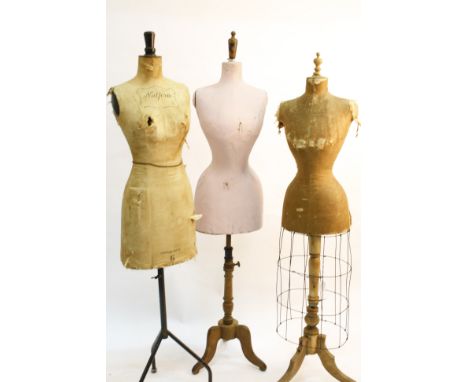 A 19th century linen covered mannequin with a metal cage frame skirt on a wooden stand; together with an early 20th century N