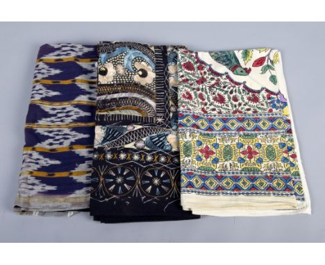 A mixed lot of textiles, comprising: velvets, brocade, bedcovers, throws, a chenille curtain, a patchwork piece and similar i