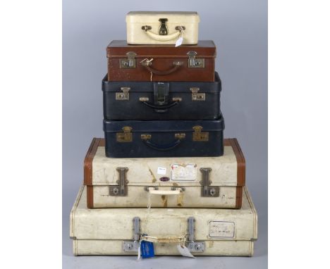 A collection of vintage suitcases, containing miscellaneous costume and textiles.