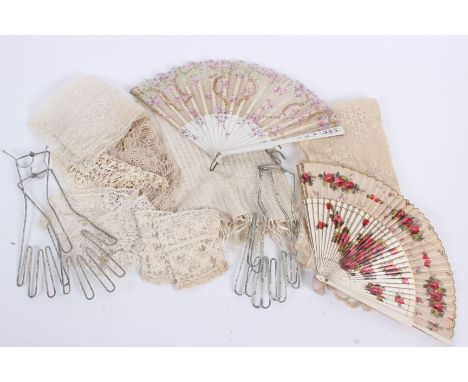 An early 20th century cream fringed shawl, a 19th century lace stole, a lace wedding veil, embroidered with flowers, a 20th c