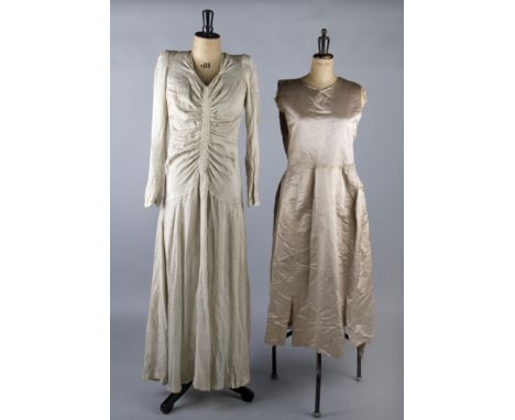 A 1930s wedding dress; together with a 1930s pale grey crepe dress, an oyster coloured satin dress, a delicate silk and chiff