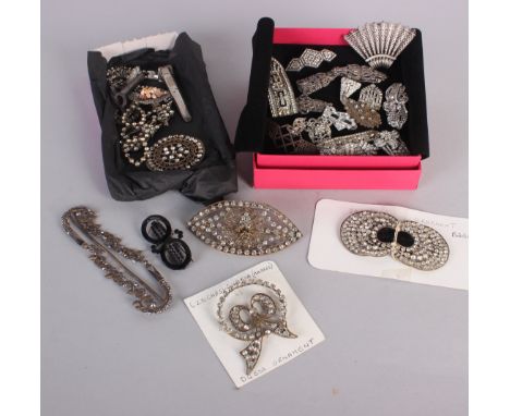 A 1930s silver and marcasite combination dress clip/brooch, a large paste brooch with central raised metal spider on a filigr