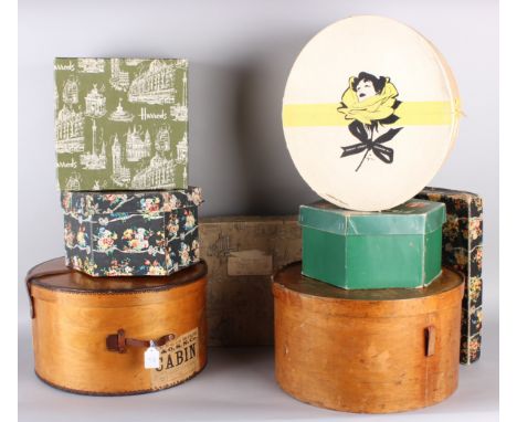 Two early 20th century wooden hat boxes, with a collection of early to mid 20th century cardboard shop hat boxes, including: 