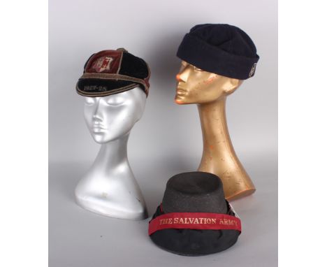 An early 20th century black straw Salvation Army bonnet; with a navy blue wool girl's school cap; and a velvet boy's school c