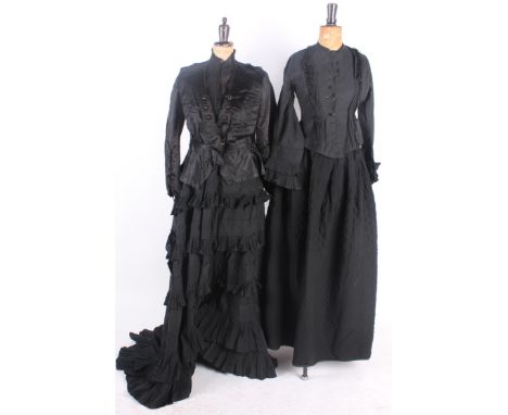 A quantity of 19th century costume, including: mourning outfits, a quilted mourning skirt, an ivory blouse with a Debenham & 